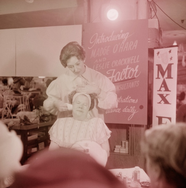 10B   Woman doing a demonstration of facial care with Max Factor products, James Smith Ltd, Manners Street, Wellington 1960 edit copy